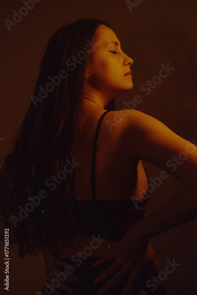 Obraz Moody Neon Portrait of Woman with Creative Lighting and Motion Blur