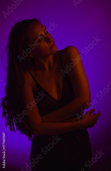 Obraz Moody Neon Portrait of Woman with Creative Lighting and Motion Blur