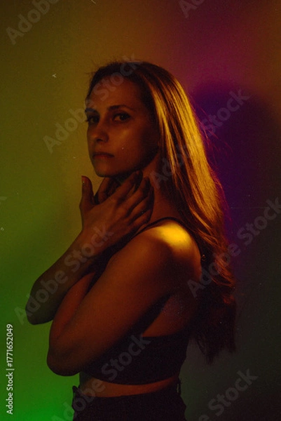 Obraz Moody Neon Portrait of Woman with Creative Lighting and Motion Blur
