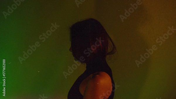 Obraz Moody Neon Portrait of Woman with Creative Lighting and Motion Blur