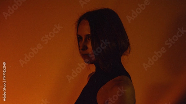 Obraz Moody Neon Portrait of Woman with Creative Lighting and Motion Blur