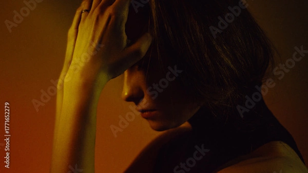 Obraz Moody Neon Portrait of Woman with Creative Lighting and Motion Blur