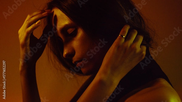 Obraz Moody Neon Portrait of Woman with Creative Lighting and Motion Blur