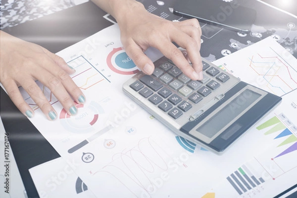 Fototapeta business accountant with document graph making calculations financial. concept planning budget and audit.