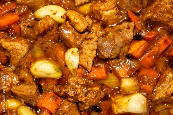 Fototapeta Roast with meat for pilaf.Filling for pilaf.Roast meat with carrots and onions.Toasted meat background.