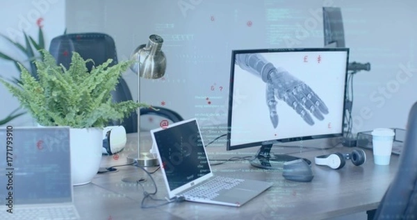 Fototapeta Showing desktop monitor featuring robotic prosthetic hand in office, with laptops, copy space