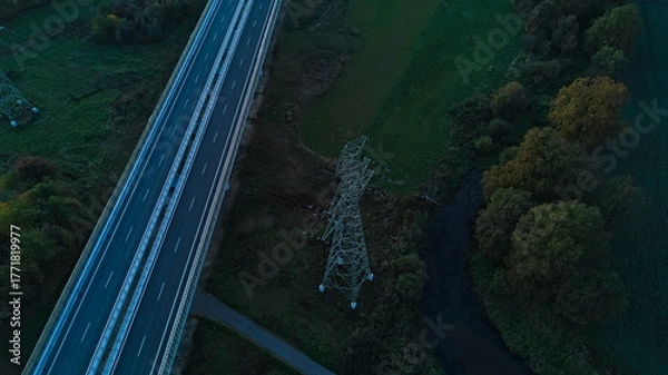 Obraz Highway and power transmission tower aerial view