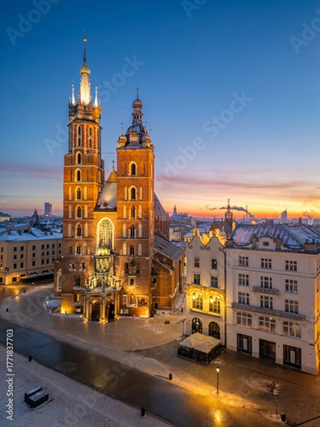 Fototapeta St Mary's church and Christmas tree on the snow covered Main Square in the winter dawn, Krakow, Poland