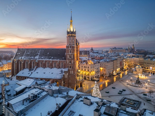 Fototapeta St Mary's church and Christmas tree on the snow covered Main Square in the winter dawn, Krakow, Poland