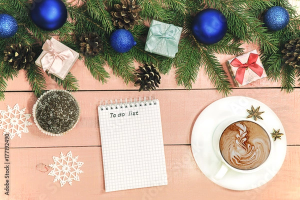 Fototapeta Christmas background with ornament  and decorated evergreen branches of fir  on the wooden pink table. Copy space for holiday text.  Xmas trendy card..