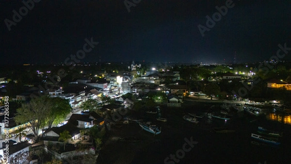 Obraz The atmosphere of Waingapu's Old Town to the Seaport seen from the air with a drone at night