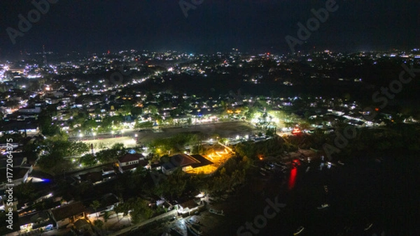 Obraz The atmosphere of Waingapu's Old Town to the Seaport seen from the air with a drone at night