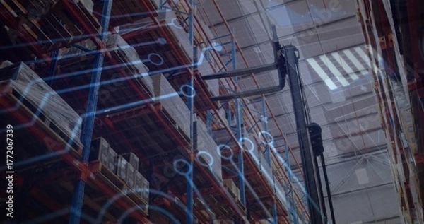 Obraz Displaying shelving racks holding boxes in warehouse, with forklift and circuit overlay, copy space