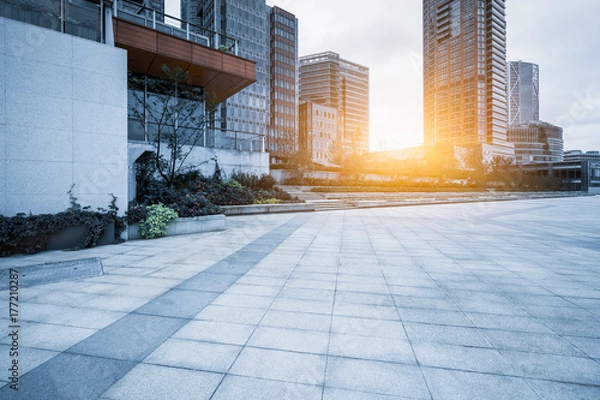 Fototapeta empty brick floor front of modern buildings