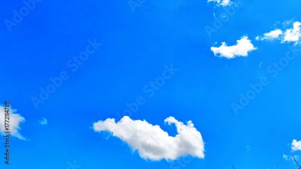 Obraz Beautiful Blue Sky with Fluffy White Clouds in Bright Sunny Day