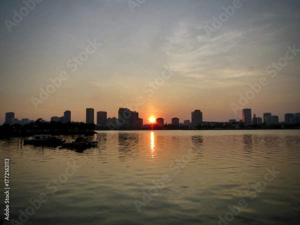 Fototapeta Urban Lakeside Sunset with Golden Reflection (Panoramic Skyline View) on West Lake in Hanoi, Vietnam