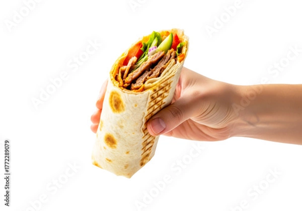 Fototapeta Hand holding a delicious shawarma wrap isolated on transparent background