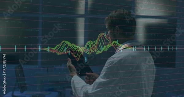 Obraz Scientist wearing lab coat holding tablet analyzing floating line chart inside lab with stations