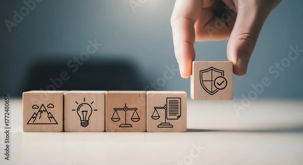 Fototapeta Hand placing security icon block on wooden cubes representing business concepts