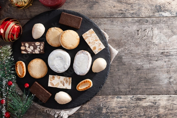 Obraz Traditional Spanish Christmas sweets assortment on wooden table. Top view. Copy Copy space