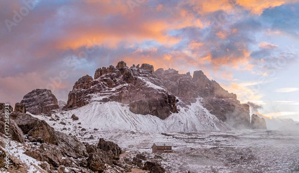 Fototapeta The beautiful snow-capped Dolomite Mountains around Tre Cime and Cadini di Misurina - captured at sunrise and sunset in gorgeous light.