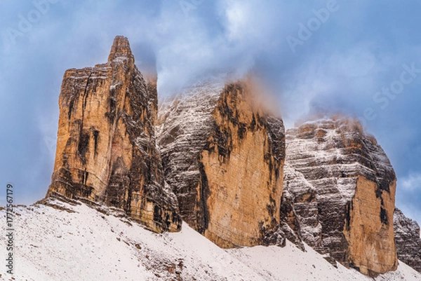 Fototapeta The beautiful snow-capped Dolomite Mountains around Tre Cime and Cadini di Misurina - captured at sunrise and sunset in gorgeous light.