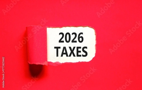 Fototapeta 2026 taxes new year symbol. Concept words 2026 taxes on beautiful white paper. Beautiful red paper background. Business and 2026 taxes new year concept. Copy space.