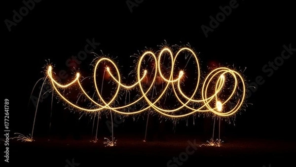 Obraz Illuminated spirals and loops of light against a stark black background, showcasing intricate patterns