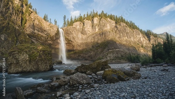 Fototapeta A Cascade Descending Over Rugged Rocky Cliffs