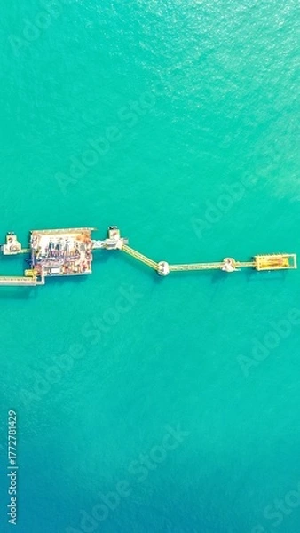 Fototapeta Aerial view of an offshore oil rig and pipeline system