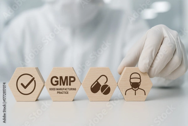 Fototapeta Focused scientist arranging wooden hexagons for GMP quality control. Pharmaceutical production standard concept with icons in sterile laboratory background showing focused compliance