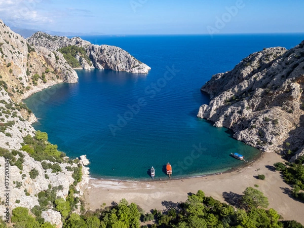 Fototapeta Kumluca bay with boats anchoring in turquoise water, Antalya Turkiye