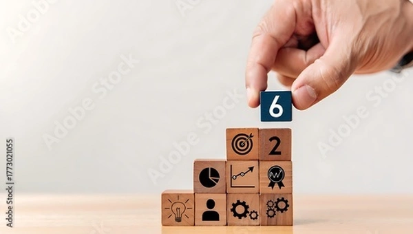 Obraz Hand placing number 6 block on stair step blocks with icons business strategy