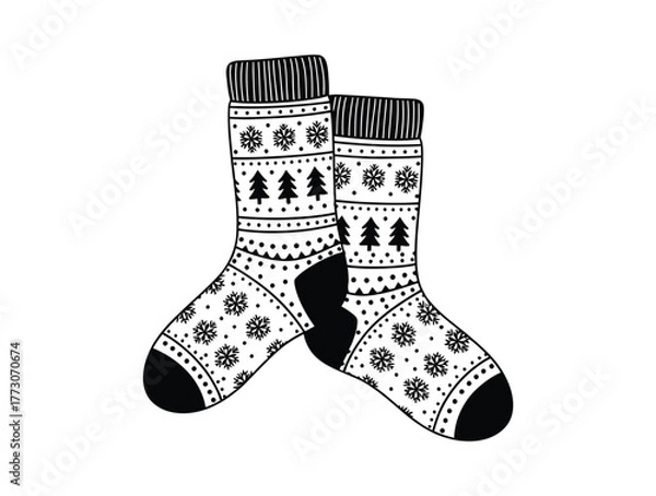 Obraz Two patterned winter socks with snowflake and Christmas tree designs are displayed.