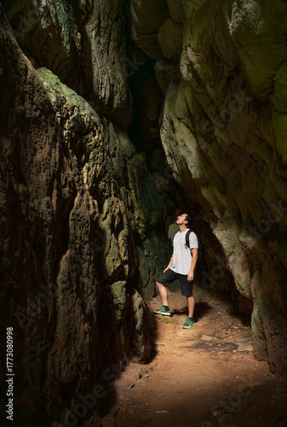 Obraz Curious Explorer Inside Natural Cave