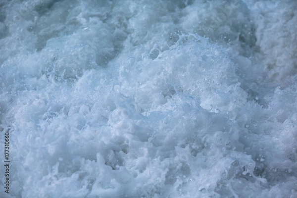 Fototapeta foaming water of the sea