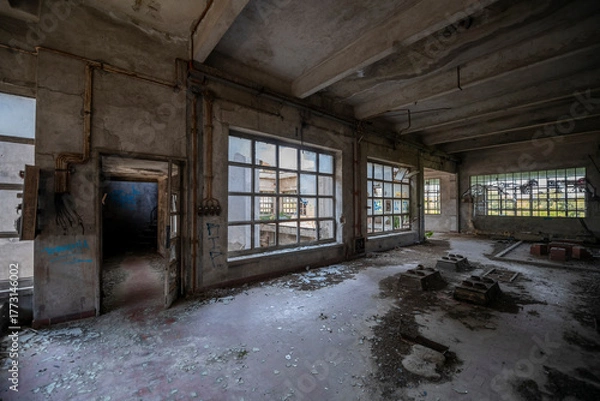 Fototapeta Abandoned distillery tower in Italy – circular industrial building with glass dome, steel beams, panoramic windows, decaying factory interior, urban exploration, post-industrial architecture