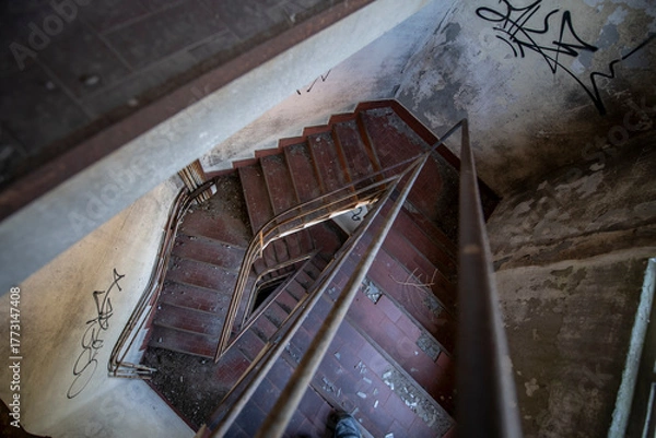 Fototapeta Abandoned distillery tower in Italy – circular industrial building with glass dome, steel beams, panoramic windows, decaying factory interior, urban exploration, post-industrial architecture