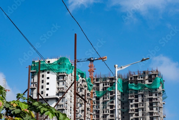 Fototapeta High-Rise Under Construction in Kolkata Using Modern Machinery
