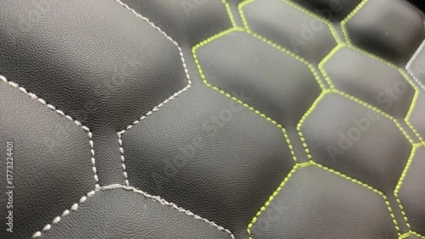 Fototapeta Beautiful thread stitching on the black leather. purpose for background