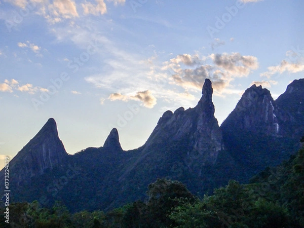 Obraz Jagged mountain peaks against a cloudy sky