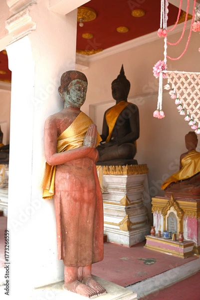 Obraz An ancient Buddha statue at a temple in Thailand
