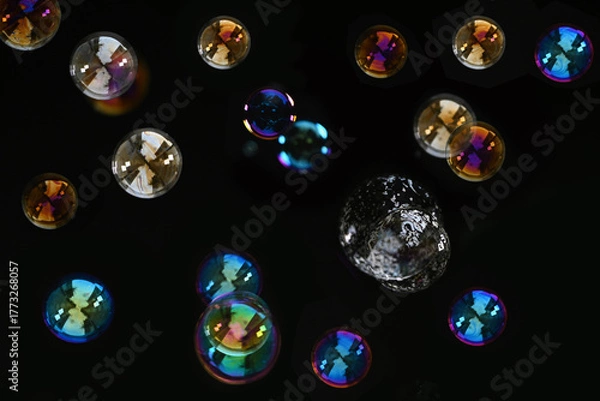 Obraz Beautiful Colorful Soap Bubbles Floating on Black Background.
