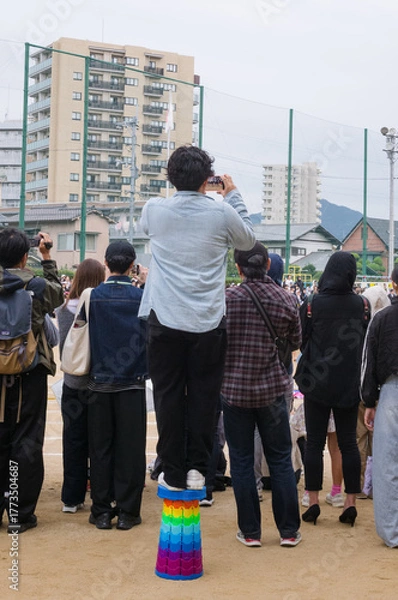 Obraz 運動会で撮影をする父兄