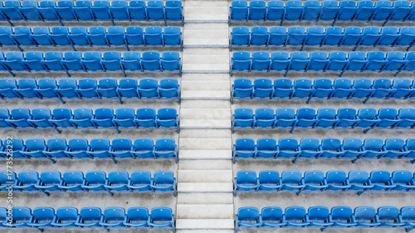 Fototapeta Symmetrical blue stadium seats from above, a serene geometric pattern of empty spaces