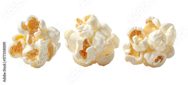 Fototapeta Three clusters of fluffy popped corn on a black background