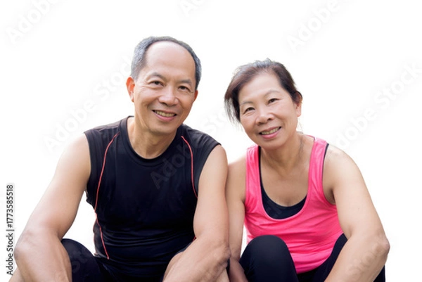 Fototapeta Healthy Senior Couple Smiling: A senior couple radiates joy and vitality as they sit side-by-side, their smiles reflecting a shared journey of health, happiness, and active living.