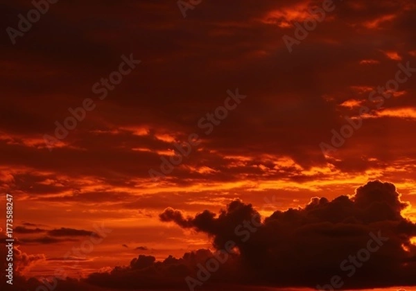 Fototapeta A vast, dramatic sky painted with deep reddish-brown and fiery orange hues, resembling oxidized metal. Cloudy formations create an intense, moody atmosphere ,brown ,sunrise ,glowing