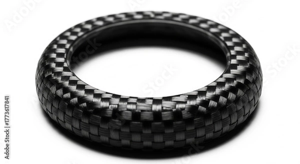 Obraz Close-up macro shot of a textured carbon fiber ring with a unique woven pattern on a plain white background, showcasing intricate material detail