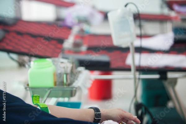 Fototapeta Loving couple showing heart symbol on hands,twilight background
